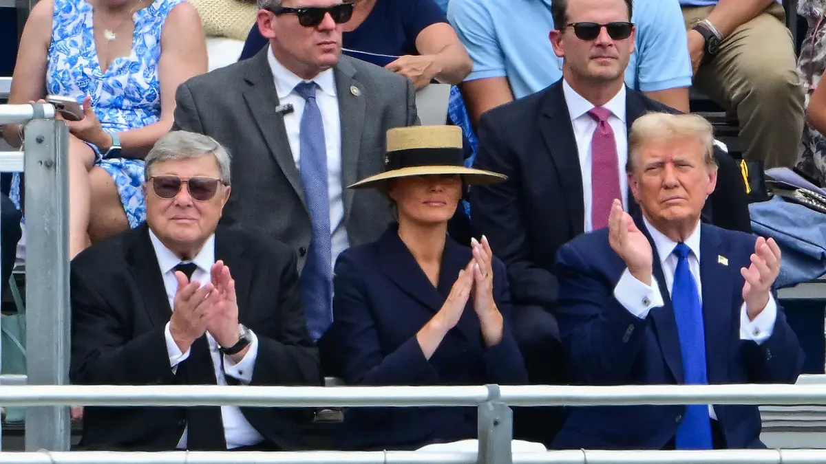 Former US President Donald Trump (R), with former First Lady Melania Trump (C) and her father Viktor Knavs (L), attends the graduation ceremony of his son, Barron Trump, at Oxbridge Academy in Palm Beach, Florida, May 17, 2024. (Photo by Giorgio VIERA / AFP)