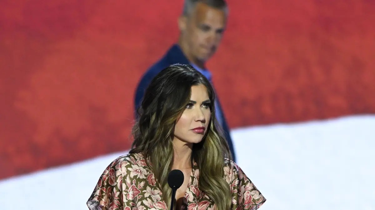 South Dakota Republican Governor Kristi Noem takes part in a sound check as political commentator Corey Lewandowski looks on at the Fiserv Forum ahead of the 2024 Republican National Convention on July 14, 2024 in Milwaukee, Wisconsin. The convention will take place from July 15th to the 18th. (Photo by ANDREW CABALLERO-REYNOLDS / AFP)