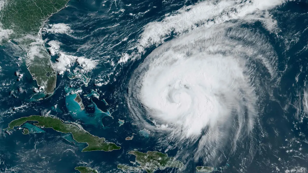 This satellite image obtained from the National Oceanic and Atmospheric Administration shows Hurricane Ernesto at 13:40 Zulu on August 15, 2024. Ernesto, a Category 1 hurricane, is moving towards Bermuda prompting hurricane warnings and is forecast to pass near or over the island on August 17. Ernesto was located about 605 miles (975kms) south-southwest of Bermuda with maximum sustained winds of 85 mph (140 kph) and was moving north at 13 mph (20 kph). (Photo by Handout / NOAA/GOES / AFP) / RESTRICTED TO EDITORIAL USE - MANDATORY CREDIT "AFP PHOTO / NOAA/GOES" - NO MARKETING NO ADVERTISING CAMPAIGNS - DISTRIBUTED AS A SERVICE TO CLIENTS
