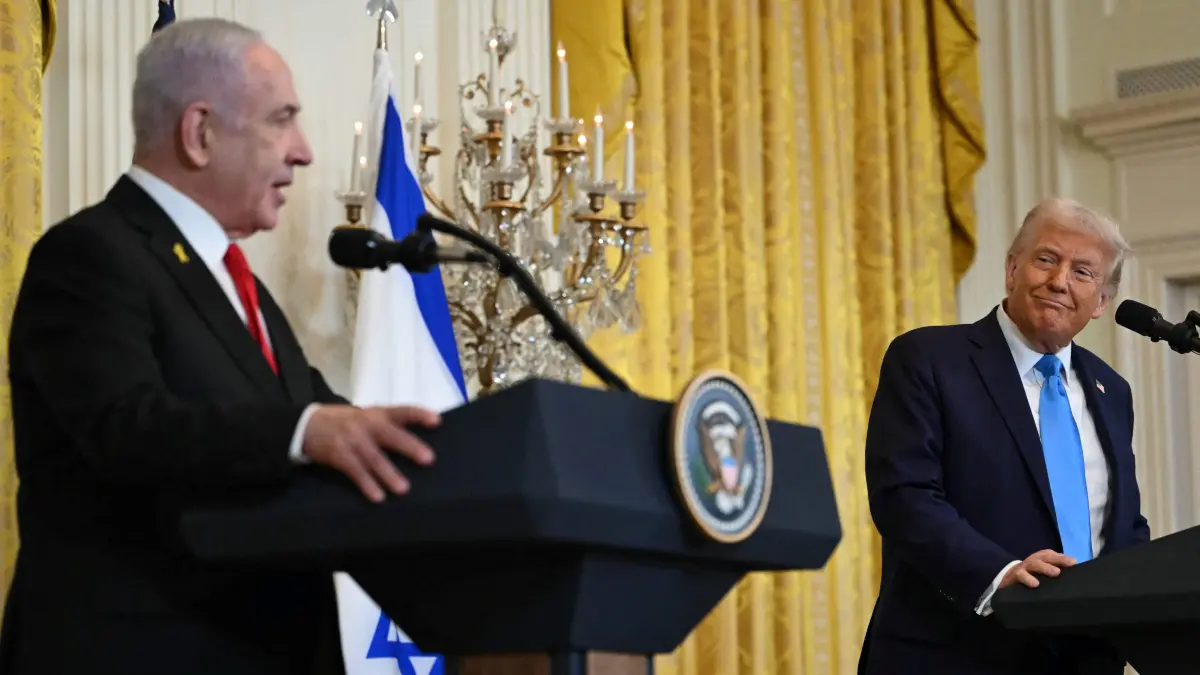 US President Donald Trump listens to Israel's Prime Minister Benjamin Netanyahu during a press conference in the East Room of the White House in Washington, DC, on February 4, 2025. Netanyahu met Trump at the White House Tuesday for crucial talks on the truce with Hamas, as the US president suggested permanently resettling Palestinians from war-battered Gaza. (Photo by ANDREW CABALLERO-REYNOLDS / AFP)