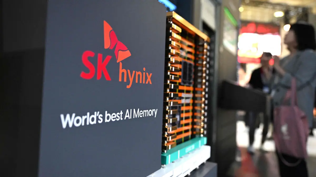 A visitor looks at a model of SK hynix's high-bandwidth memory (HBM) technology during the 2025 World IT Show in Seoul on April 24, 2025. South Korean chip giant SK hynix reported record quarterly profits on April 24, thanks to soaring global demand for artificial intelligence, highlighting the firm's ability to weather mounting tariff threats. (Photo by Jung Yeon-je / AFP)