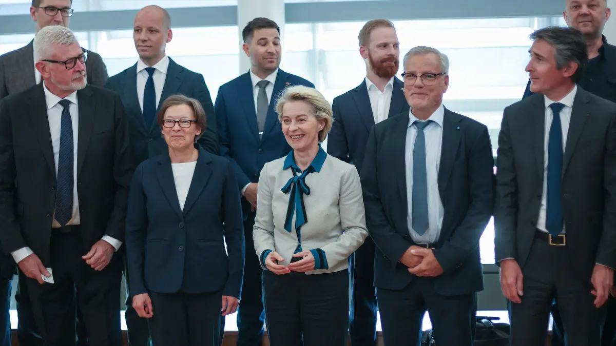 European Commission President Ursula Von der Leyen (C) poses for family photo with captians of European Defense industry during a strategic dialogue meeting meeting in Brussels, on May 12, 2025. (Photo by OLIVIER HOSLET / POOL / AFP)