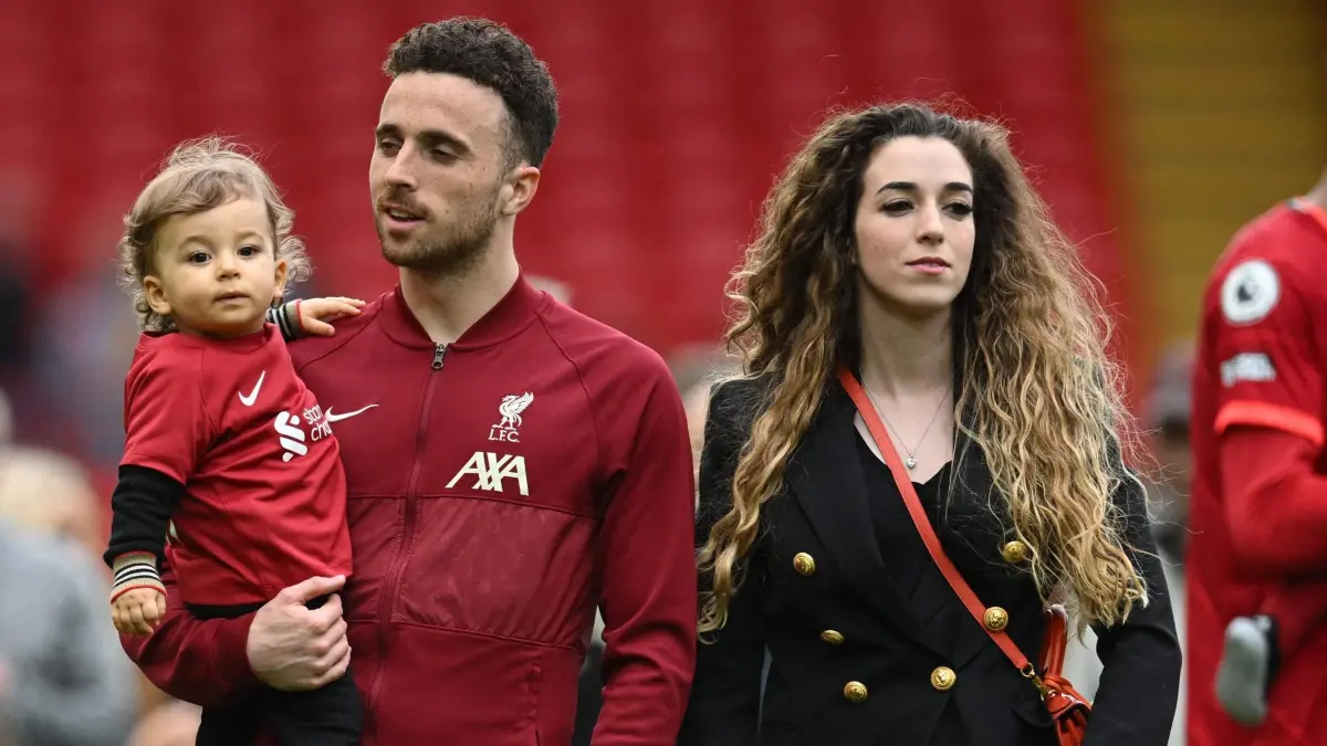 (FILES) Liverpool's Portuguese striker Diogo Jota celebrates his family during a lap of honour at the end of the English Premier League football match between Liverpool and Wolverhampton Wanderers at Anfield in Liverpool, north west England on May 22, 2022. Liverpool striker Diogo Jota died along with his brother early July 3, 2025 in a road accident in northwest Spain, the Spanish Civil Guard said. The accident occurred around 12:30 a.m. on a highway in the province of Zamora. The vehicle "left the road" before bursting into flames, the Civil Guard said, adding that the two passengers, Diogo Jota and his brother Andre Felipe, also a professional footballer, were deceased. (Photo by Paul ELLIS / AFP) / RESTRICTED TO EDITORIAL USE. No use with unauthorized audio, video, data, fixture lists, club/league logos or 'live' services. Online in-match use limited to 120 images. An additional 40 images may be used in extra time. No video emulation. Social media in-match use limited to 120 images. An additional 40 images may be used in extra time. No use in betting publications, games or single club/league/player publications. /