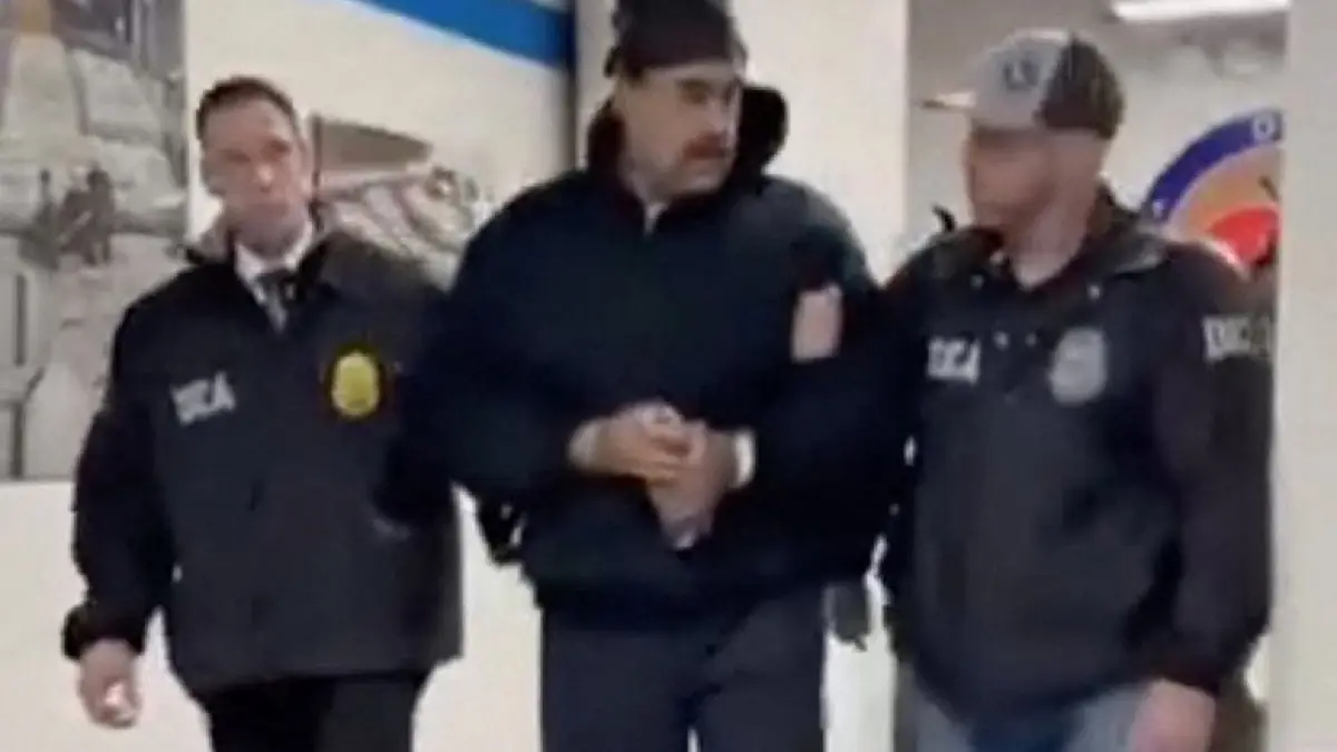 US military intervention in Venezuela: This screengrab taken from the X account of Rapid Response 47, the official White House rapid response account, shows Venezuelan President Nicolas Maduro (C) escorted by DEA agents inside the headquarters of the US Drug Enforcement Administration (DEA) in lower Manhattan, New York, on January 3, 2026. President Donald Trump said January 3 that the United States will "run" Venezuela and tap its huge oil reserves after seizing leftist leader Nicolas Maduro during a bombing raid on Caracas.
Trump's announcement came hours after a lightning pre-dawn attack in which special forces grabbed Maduro and his wife -- while air strikes pounded sites in and around the capital city -- then whisked him out of the country. (Photo by X account of Rapid Response 47 / AFP) / RESTRICTED TO EDITORIAL USE - MANDATORY CREDIT "AFP PHOTO / X account of Rapid Response 47" - HANDOUT - NO MARKETING NO ADVERTISING CAMPAIGNS - DISTRIBUTED AS A SERVICE TO CLIENTS