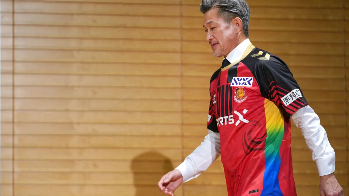 Japanese footballer Kazuyoshi Miura, 58, shows his Fukushima United FC uniform during a press conference in Tokyo on January 9, 2026. (Photo by Kazuhiro NOGI / AFP)