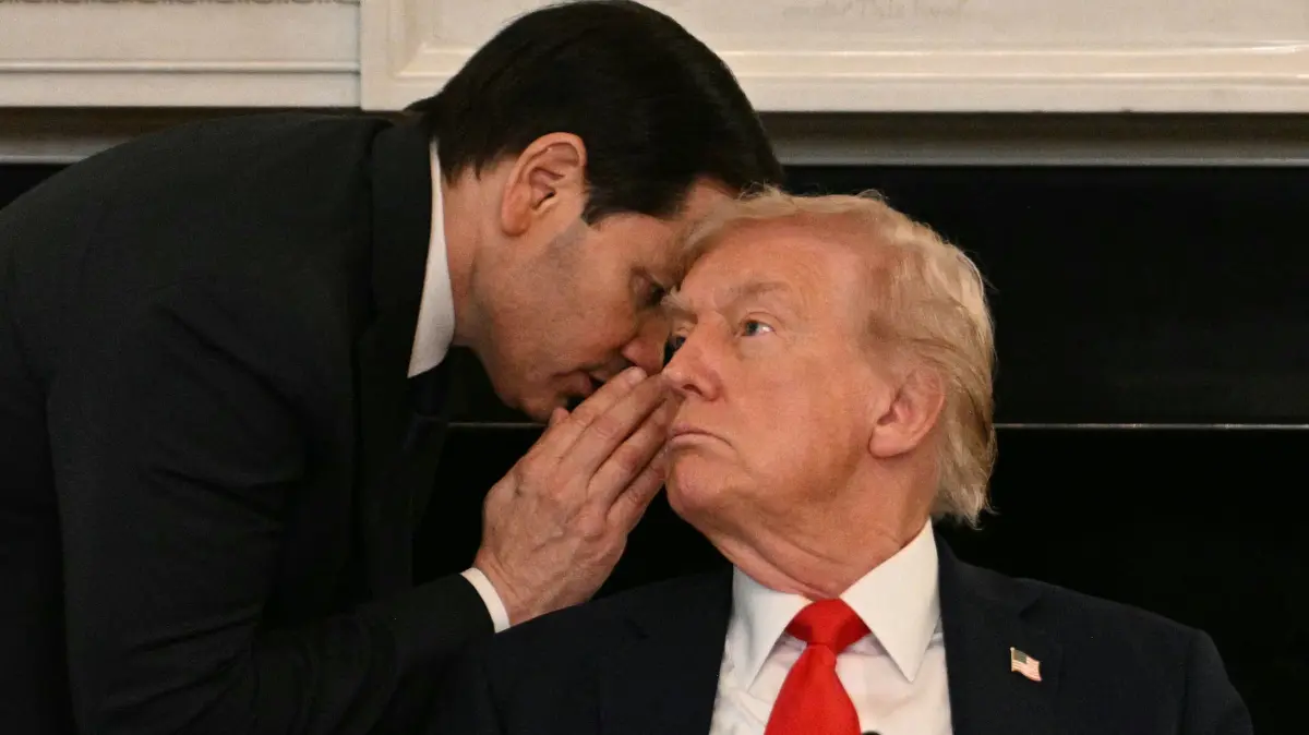 Mini package : One year of Trump presidency: (FILES) US Secretary of State Marco Rubio whispers in the ear of President Donald Trump during a roundtable about Antifa in the State Dining Room of the White House in Washington, DC, on October 8, 2025. One year into his second term, US President Donald Trump is shattering the post-World War II order as never before, leaving a world that may be unrecognizable once he is through. Far from slowing down, Trump has rung in the new year with a slew of aggressive actions that brazenly defy the decades-old order that was championed by the United States. (Photo by Jim WATSON / AFP)