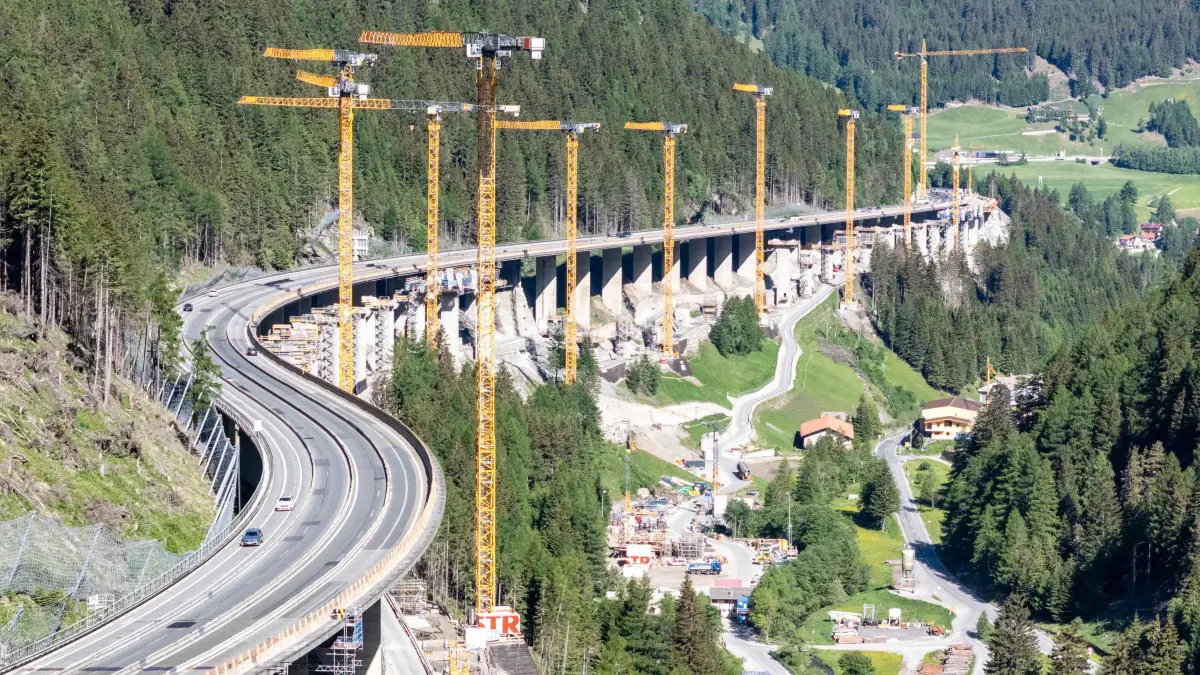 This aerial view shows the construction site of the A13 Brenner Highway at the Lueg Bridge (Luegbruecke) in the direction of Italy during a demonstration against transit traffic and the blockade of the Brenner Base Tunnel on May 30, 2026, on the Tyrolean Brenner Highway. A protest in Austria on May 30 against noise and pollution is set to close one of Europe's most important highways connecting Germany and Italy, potentially causing major traffic disruptions.
Communities in Austria's western Tyrol province have long complained about traffic, especially trucks passing over the Brenner Pass and through the province. (Photo by EXPA/ JOHANN GRODER / APA / AFP) / Austria OUT
