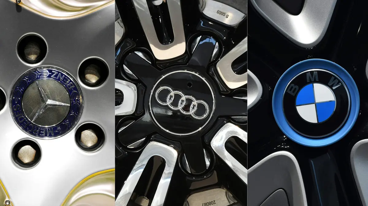 (COMBO) This combination of file pictures created on October 23, 2017 shows (From L)
the logo of German car brand Mercedes-Benz on the wheel of a Concept BlueZERO car, the logo of the German car producer Audi on a wheel of a car, the logo of the German car maker BMW on a wheel of a car, the logo of German car maker Porsche on a wheel, and a Volkswagen's logo on the wheel of a Tiguan.
Volkswagen and Mercedes-Benz maker Daimler both admitted separately that they were under investigation, while BMW had confirmed on on October 20, 2017 it was the subject of a raid. Back in July, news weekly Der Spiegel had reported that Volkswagen, Daimler, Audi, Porsche and BMW secretly worked together from the 1990s on car development, construction and logistics. / AFP PHOTO