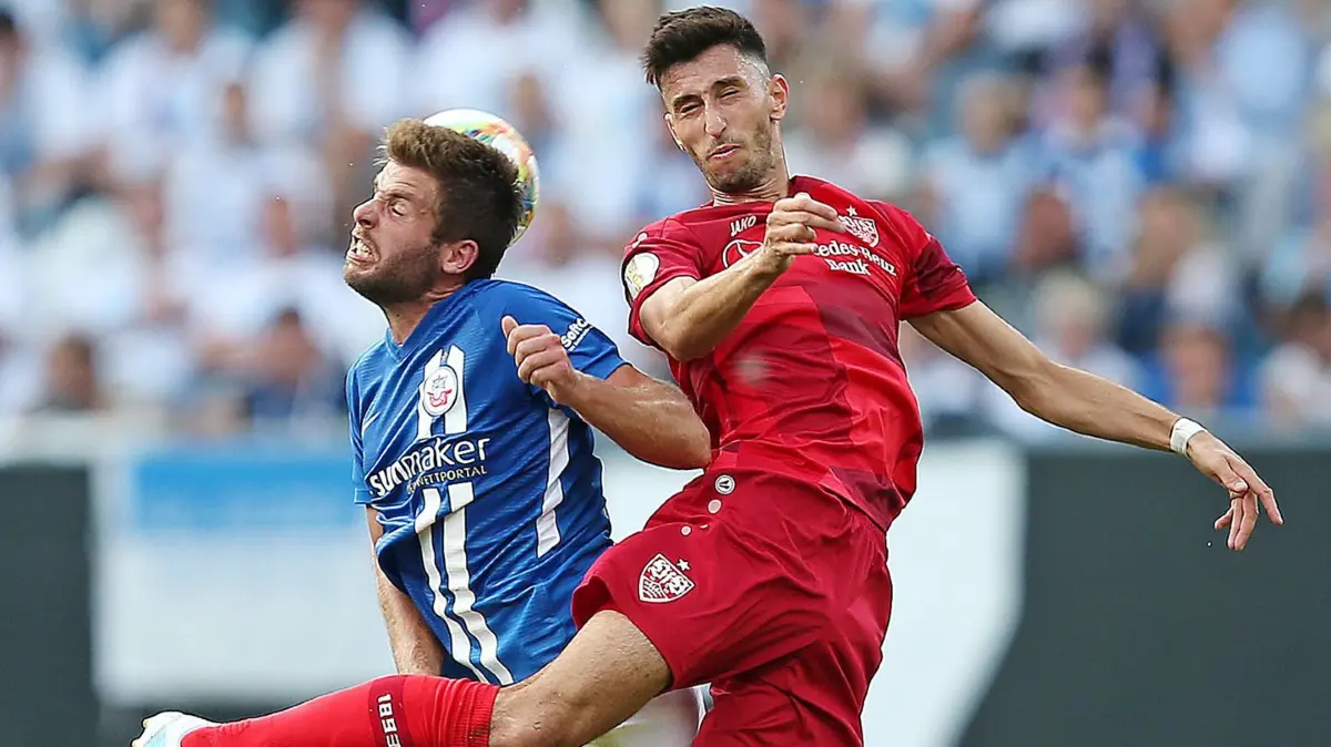 BAU // Rostock , Fußball DFB Pokal 1. Runde , Hansa Rostock vs. VfB Stuttgart , (L-R) Marco Königs (Hansa Rostock) , Atakan Karazor (Stuttgart)
DFB REGULATIONS PROHIBIT ANY USE OF PHOTOGRAPHS AS IMAGE SEQUENCES AND/OR QUASI-VIDEO. Gemäß den Vorgaben des DFB Deutschen Fu?ball Bundes ist es untersagt, im Stadion und/oder vom Spiel angefertigte Fotoaufnahmen in Form von Sequenzbildern und/oder videoähnlichen Fotostrecken zu verwerten bzw. verwerten zu lassen.