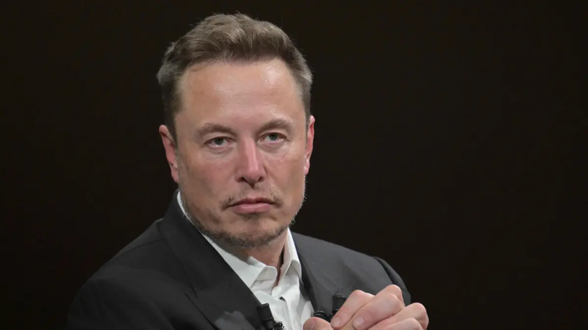 (FILES) SpaceX, Twitter and electric car maker Tesla CEO Elon Musk looks on as he speaks during his visit at the Vivatech technology startups and innovation fair at the Porte de Versailles exhibition center in Paris, on June 16, 2023. Elon Musk's SpaceX began its first day as a public company on Wall Street on June 12, 2026, after the biggest initial public offering in history, with the polarizing entrepreneur promising he will take humanity to Mars. The blockbuster operation, which raised more than $75 billion, is expected to make Musk the world's first trillionaire and kick off a series of major IPOs by AI companies in the coming months. (Photo by Alain JOCARD / AFP)