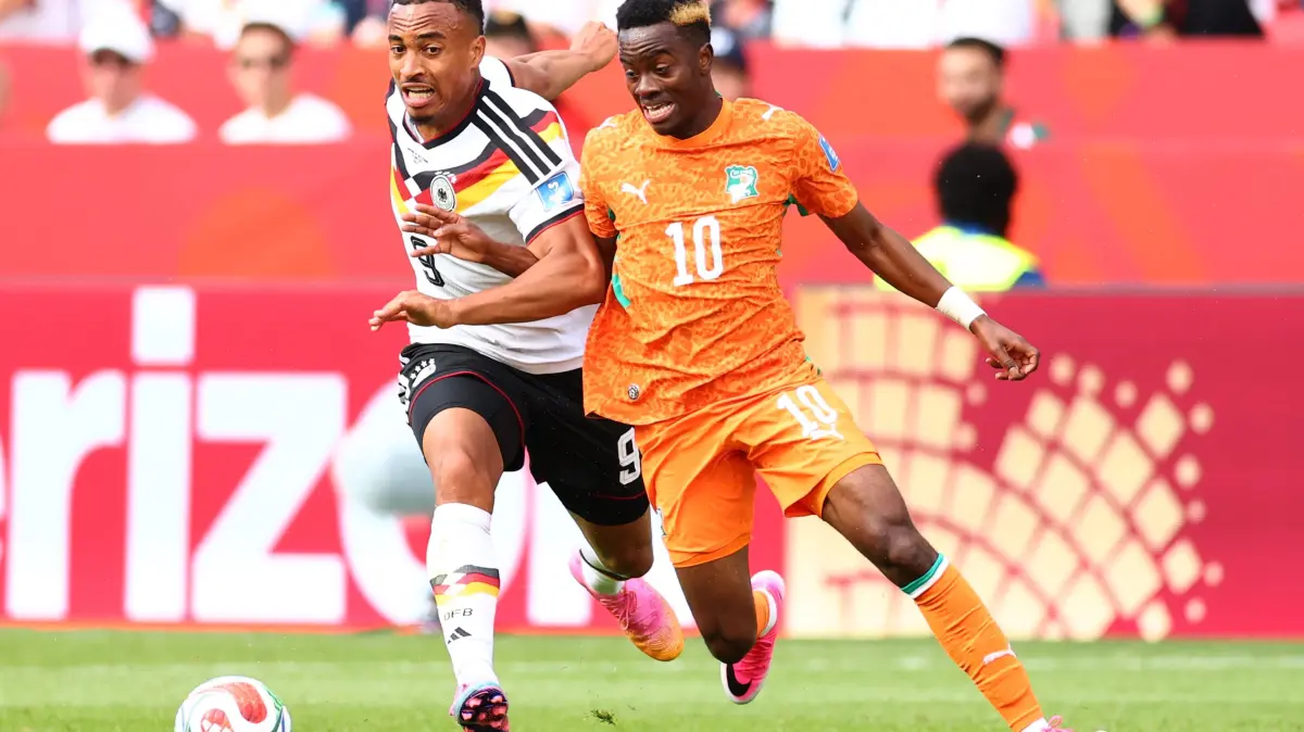 Germany v Cote D'Ivoire: Group E - FIFA World Cup 2026: TORONTO, ONTARIO - JUNE 20: Jamie Leweling #9 of Germany and Simon Adingra #10 of Cote d'Ivoire compete for the ball during the FIFA World Cup 2026 Group E match between Germany and Cote D'Ivoire at Toronto Stadium on June 20, 2026 in Toronto, Ontario. Robert Cianflone/Getty Images/AFP (Photo by ROBERT CIANFLONE / GETTY IMAGES NORTH AMERICA / Getty Images via AFP)