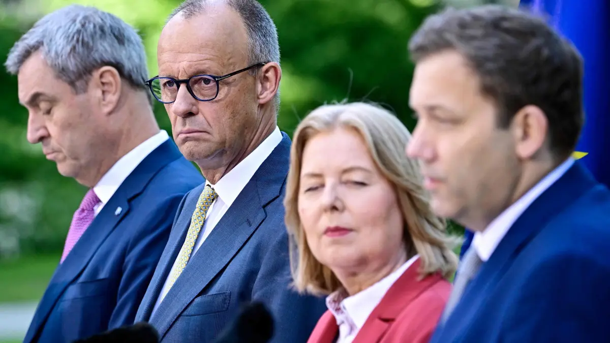 GERMANY-POLITICS-GOVERNMENT-COALITION-COMMITTEE: (L-R) Bavaria's State Premier and leader of the conservative Christian Social Union (CSU) Markus Soeder, German Chancellor Friedrich Merz (CDU), German Minister for Labour and Social Affairs Baerbel Bas (SPD) and German Finance Minister and Vice Chancellor Lars Klingbeil (SPD) address a press conference, on July 2, 2026 in the garden of the Chancellery in Berlin, one day after their coalition committee consultations on a major package of reforms. (Photo by Tobias SCHWARZ / AFP)