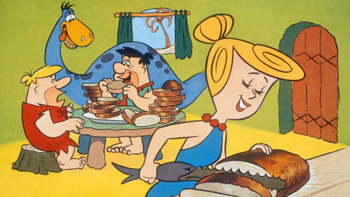 Traditionelles familiäres Rollenbild, wie es seit der Steinzeit bis zum Aufstieg der Grünen in Stein gemeißelt war (Szene aus "The Flintstones" mit Barney Rubble (li.), Fred Flintstone und Wilma Flintstone (re.).