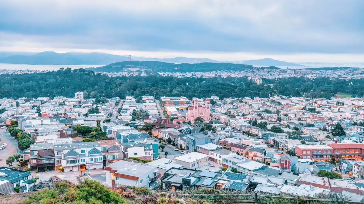 San Francisco, California, USA - October 5, 2021, Evening view of the city from the top of San Francisco's Grandview Park next to the 16th Avenue tiled steps. Photo edited, in pastel colors.