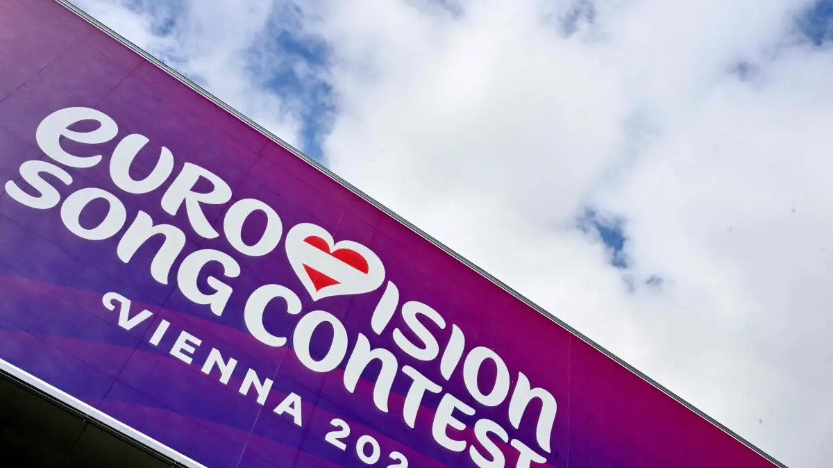 FILES-SWITZERLAND-ENTERTAINMENT-CONFLICT-MUSIC-TELEVISION-EUROVI: (FILES) The logo of the Eurovision Song Contest (ESC) is seen on the facade of the Stadthalle in Vienna on April 1, 2026. The organisers of the Eurovision Song Contest announced a rules change on August 12, 2026 excluding any country in an armed conflict from hosting the competition. (Photo by HANS KLAUS TECHT / APA / AFP) / Austria OUT