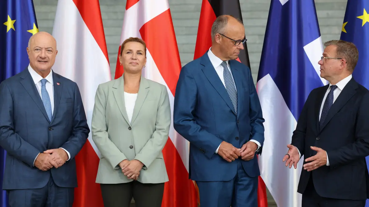: (From L) Austria's Chancellor Christian Stocker, Denmark's Prime Minister Mette Frederiksen, German Chancellor Friedrich Merz and Finland's Prime Minister Petteri Orpo pose for a group photo prior to a meeting at the Chancellery in Berlin, on August 27, 2026. (Photo by Odd ANDERSEN / AFP)