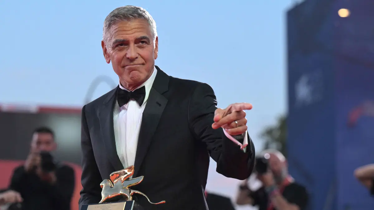 ITALY-CINEMA-VENICE-FILM-FESTIVAL-MOSTRA: US actor and filmmaker George Clooney poses after he received the Golden Lion for Lifetime Achievement during the opening ceremony of the 83rd International Venice Film Festival, on September 2, 2026 at Venice Lido. (Photo by Tiziana FABI / AFP)