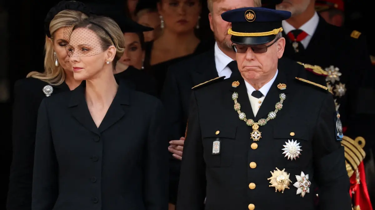 NORWAY-ROYALS-HARALD-FUNERAL: Prince Albert II of Monaco, Charlene of Monaco and other guests leave after the funeral service for late King Harald V of Norway before the casket is moved in a procession from Oslo Cathedral to Akershus Castle in Oslo, Norway, on September 9, 2026. (Photo by Odd ANDERSEN / AFP)