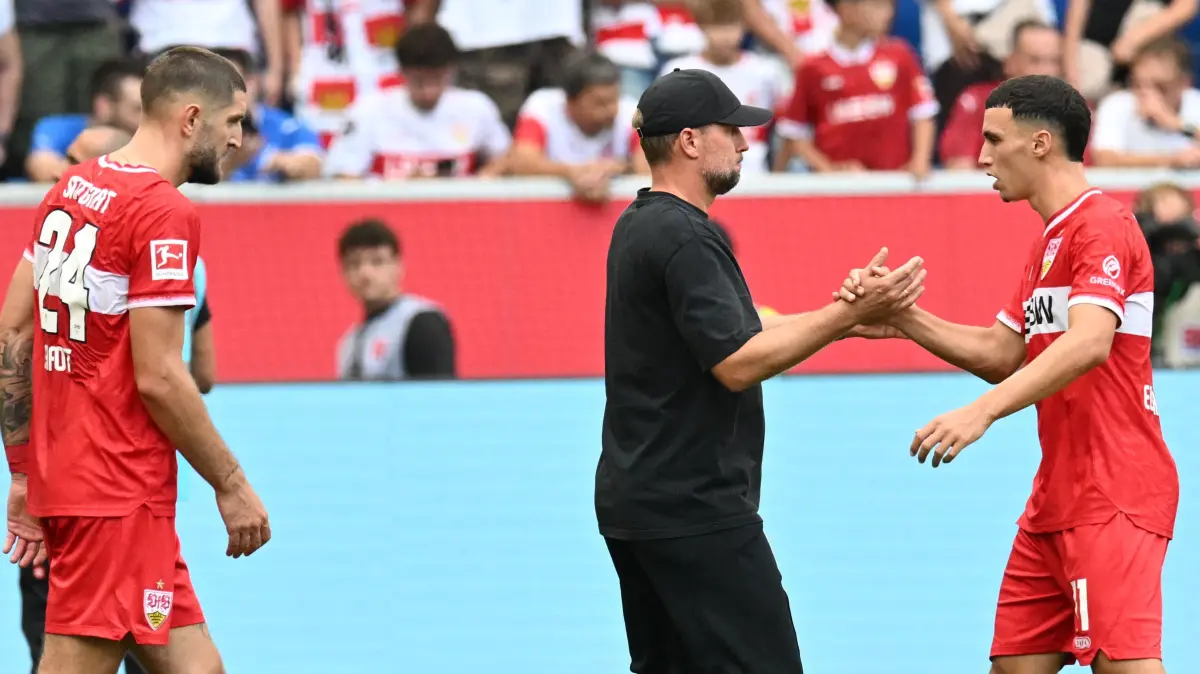 FBL-GER-BUNDESLIGA-HOFFENHEIM-STUTTGART: Stuttgart's German head coach Sebastian Hoeness shakes hands with Stuttgart's Moroccan forward #11 Bilal El Khannouss after the German first division Bundesliga football match between Hoffenheim and VfB Stuttgart in Sinsheim on September 12, 2026. (Photo by THOMAS KIENZLE / AFP) / DFL REGULATIONS PROHIBIT ANY USE OF PHOTOGRAPHS AS IMAGE SEQUENCES AND/OR QUASI-VIDEO