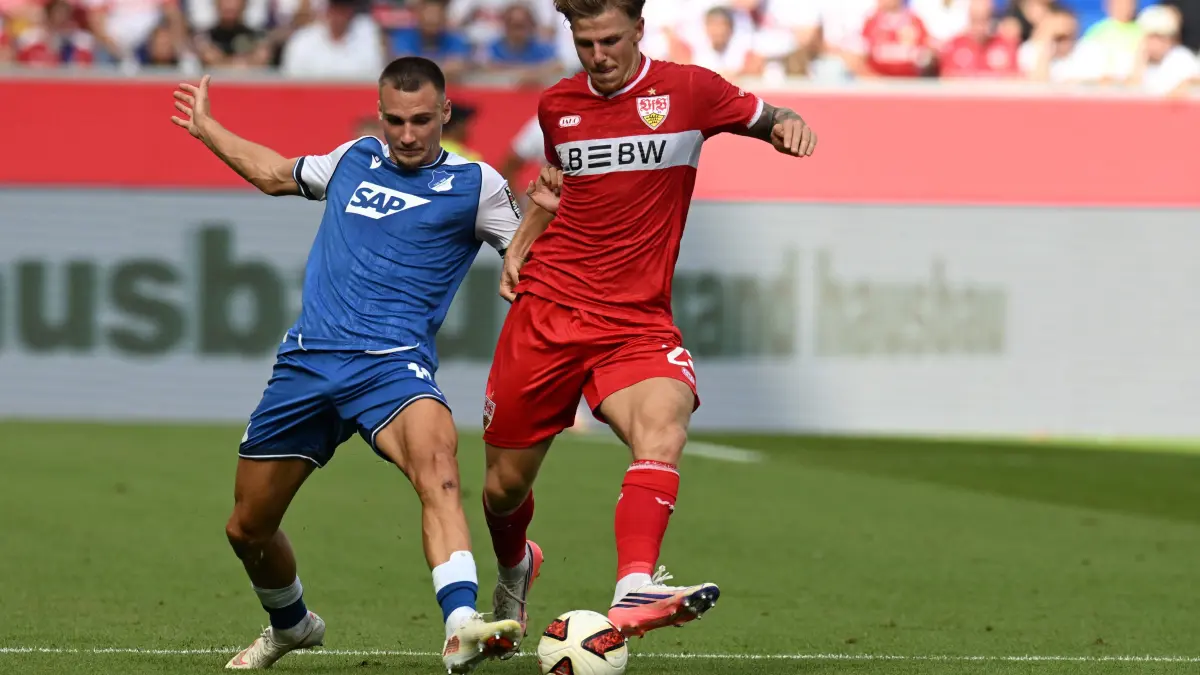 FBL-GER-BUNDESLIGA-HOFFENHEIM-STUTTGART: Hoffenheim's German forward #19 Tim Lemperle (L0 and Stuttgart's German defender #29 Finn Jeltsch vie for the ball during the German first division Bundesliga football match between Hoffenheim and VfB Stuttgart in Sinsheim on September 12, 2026. (Photo by THOMAS KIENZLE / AFP) / DFL REGULATIONS PROHIBIT ANY USE OF PHOTOGRAPHS AS IMAGE SEQUENCES AND/OR QUASI-VIDEO