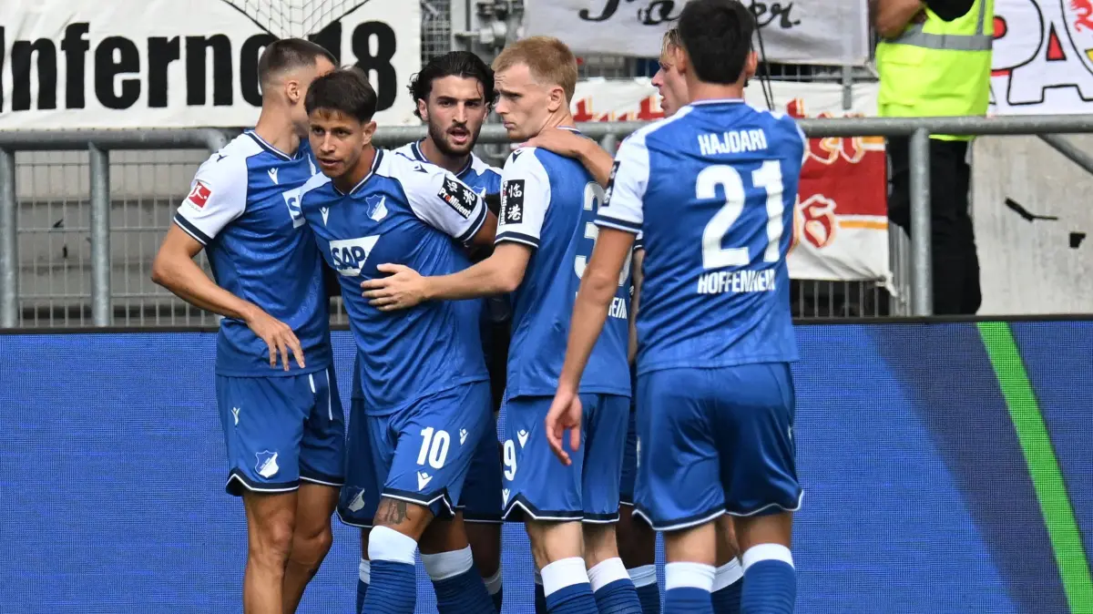 FBL-GER-BUNDESLIGA-HOFFENHEIM-STUTTGART: Hoffenheim's Czech forward #10 Adam Hlozek (2L) celebrates with teammates scoring the opening goal during the German first division Bundesliga football match between Hoffenheim and VfB Stuttgart in Sinsheim on September 12, 2026. (Photo by THOMAS KIENZLE / AFP) / DFL REGULATIONS PROHIBIT ANY USE OF PHOTOGRAPHS AS IMAGE SEQUENCES AND/OR QUASI-VIDEO