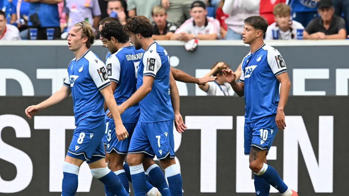 FBL-GER-BUNDESLIGA-HOFFENHEIM-STUTTGART: Hoffenheim's Czech forward #10 Adam Hlozek (R) celebrates with teammates scoring the 2-1 during the German first division Bundesliga football match between Hoffenheim and VfB Stuttgart in Sinsheim on September 12, 2026. (Photo by THOMAS KIENZLE / AFP) / DFL REGULATIONS PROHIBIT ANY USE OF PHOTOGRAPHS AS IMAGE SEQUENCES AND/OR QUASI-VIDEO