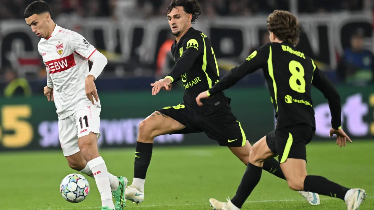 FBL-EUR-C1-STUTTGART-ATLETICO MADRID: Stuttgart's Moroccan forward #11 Bilal El Khannouss vies for the ball with Atletico Madrid's Spanish defender #18 Marc Pubill and Atletico Madrid's Nigerian forward #11 Ademola Lookman during the UEFA Champions League football match VfB Stuttgart v Atletico Madrid in Stuttgart, southern Germany, on October 20, 2026. (Photo by THOMAS KIENZLE / AFP)