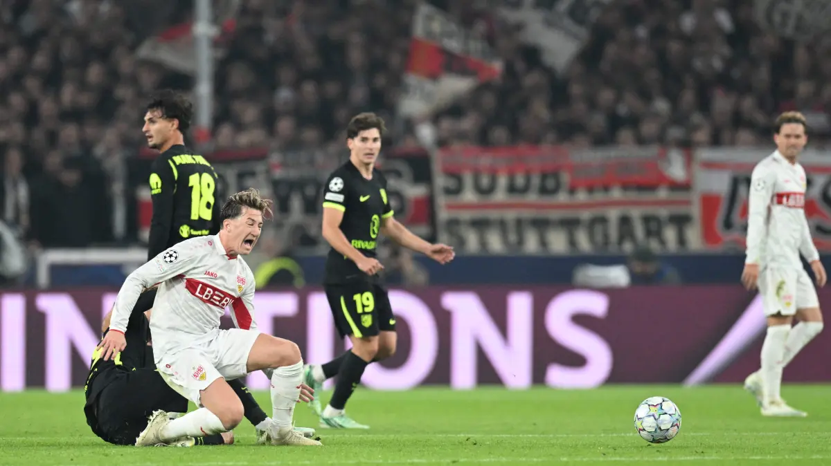 FBL-EUR-C1-STUTTGART-ATLETICO MADRID: Stuttgart's German midfielder #06 Angelo Stiller is fouled by Atletico Madrid's Danish midfielder #23 Morten Hjulmand during the UEFA Champions League football match VfB Stuttgart v Atletico Madrid in Stuttgart, southern Germany, on October 20, 2026. (Photo by THOMAS KIENZLE / AFP)